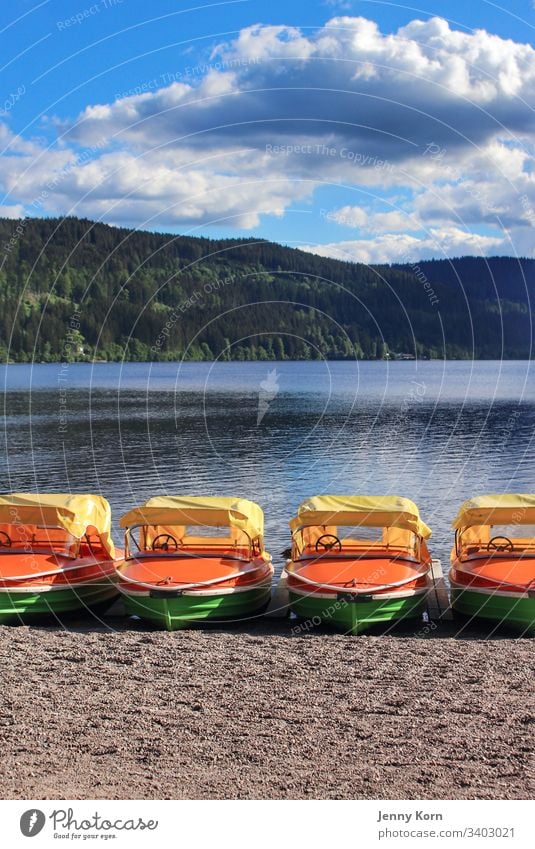 Boats in the break boat Lake vacation Water Watercraft Exterior shot Blue sky Deserted Colour photo Vacation & Travel Relaxation Summer Tourism Orange Yellow