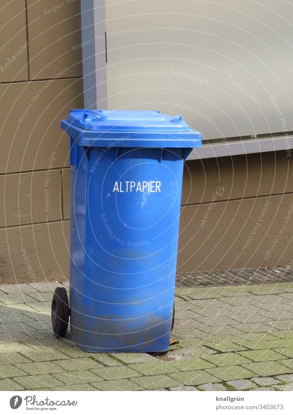 blue waste paper bin standing at the roadside Waste paper Waste paper bin Recycling Paper Colour photo Deserted Trash Day Exterior shot Blue Multicoloured