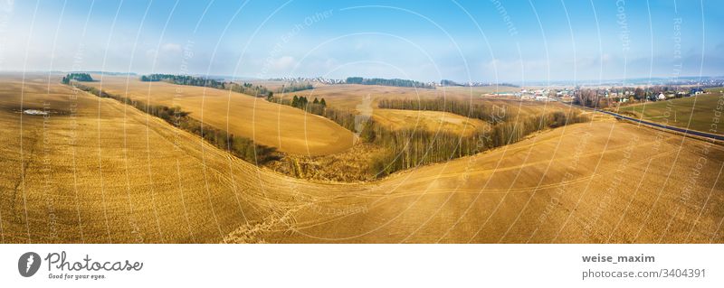 Panorama of empty plowed field in early spring. Beginning of the gardening season, aerial view agriculture cultivated scene rural industrial sunny outdoor