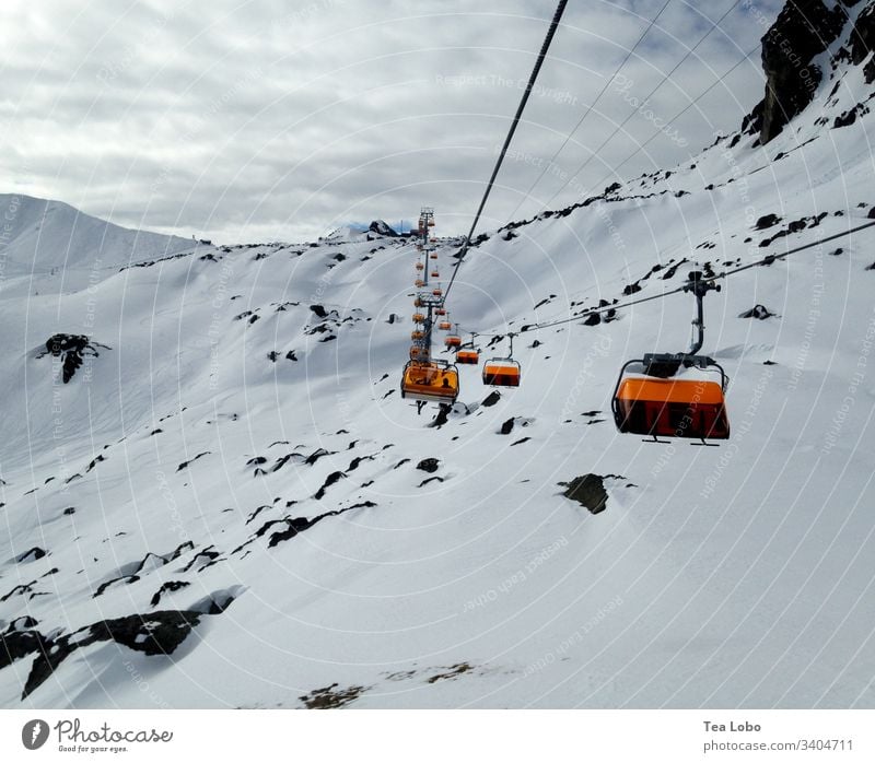 Ski lift to the peak Skiing Ski resort snow gondola Alps Winter Winter vacation Exterior shot Mountain Ski run Sky Austria Cold Peak Vacation & Travel