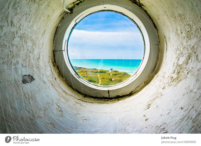 The North Sea coast through a porthole Lighthouse Ocean Beach Germany Denmark Norway Marram grass duene Turquoise Meadow Hilly landscape ocean Atlantic Ocean