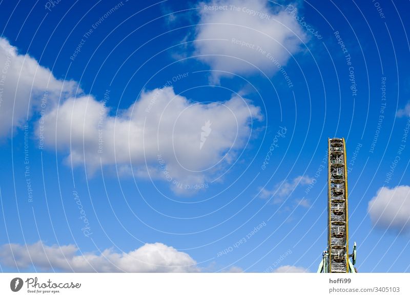 Ferris wheel with clouds and blue sky Wheel Public Holiday Festival Circle Carousel Construction Carnival Blue sky Amusement Park pleasure Action Sky