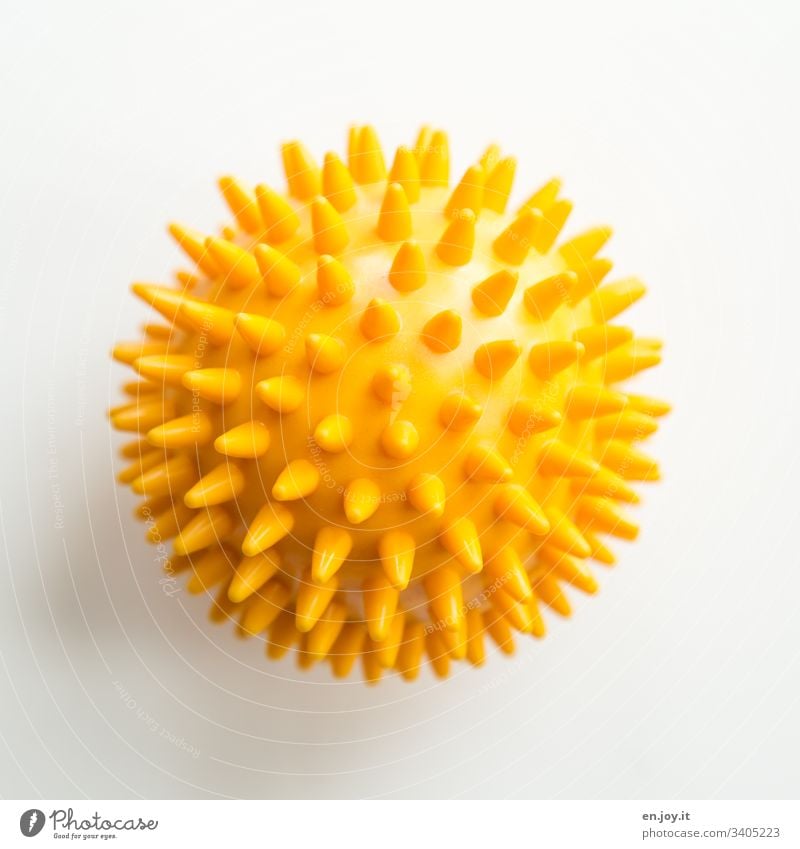 Yellow ball with spikes prickles Physiotherapy Therapy Illness Healthy Sports coronavirus Virus Round Hedgehog ball Ball