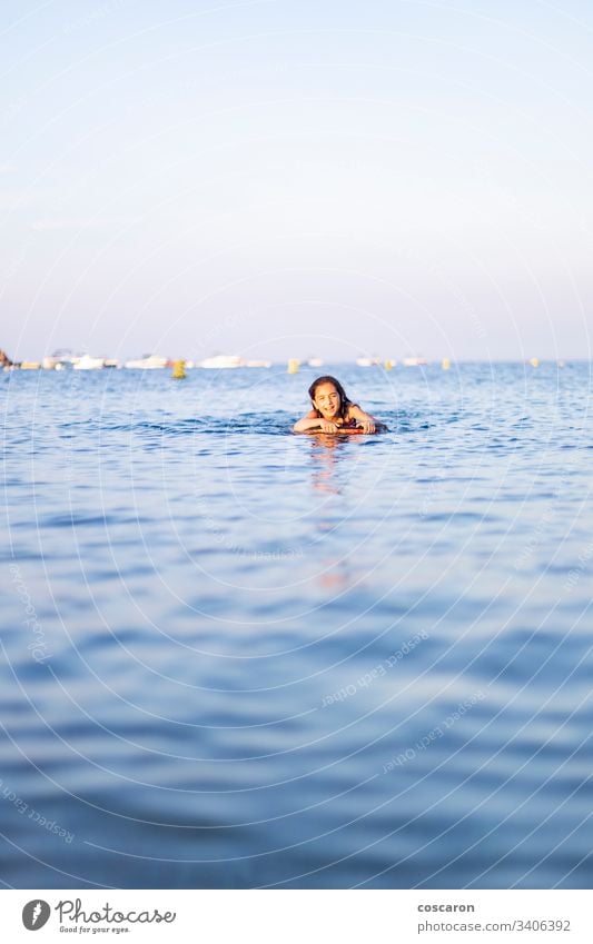 Little child with a bodysurf on the sea active activity beach beautiful beauty blue board boarding bodyboard bodyboarding bodysurfing cheerful childhood coast