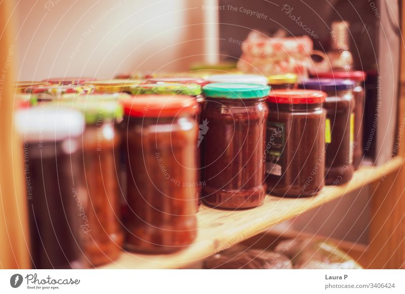 Shelf with jars of jam Kitchen Jam Jam jar Conserve screwed glass Preserving jar Vintage grandma grandmother Fruit Self-made Food Wooden table Delicious Fresh