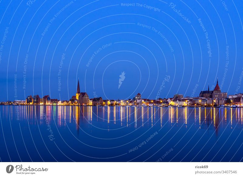 View over the Warnow river to the city of Rostock in the evening Town River Mecklenburg-Western Pomerania Warnov city harbour Architecture houses Building