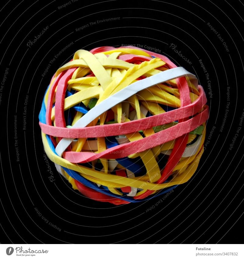 The object of desire - A ball of rubber bands on a brown blanket household rubbers Shallow depth of field Colour photo Deserted Close-up Ball Sphere variegated