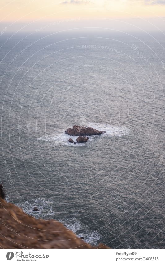 Lonely rock on the middle of the sea 1 ocean landscape vertical atlantic stone coast water shore scenic scenery wave winter natural coastline erosion coastal