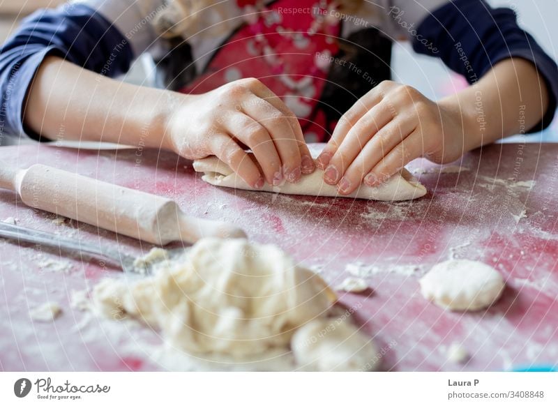 Close up of little girl's hands playing with dough close up baking cooking fingers child kid toddler Colour photo Baked goods Flour sweets home-made food