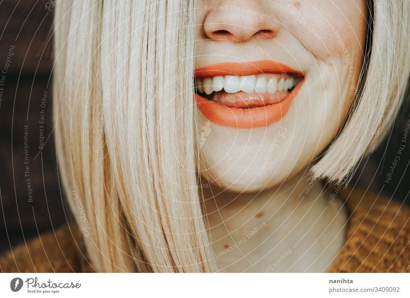 Close up of the hair and lips of a young woman hairstyle sensual close up face pretty blonde matte lipstick skin care cosmetics real part of portrait real woman