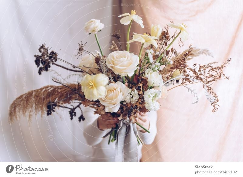 Young woman in a white dress holding a bouquet of flowers. Vintage, romantic concept. girl soft light beautiful vintage wedding young beauty happy pink cute