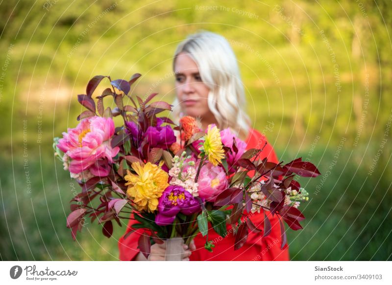 Beautiful blonde florist woman hold wonderful bouquet Half-profile Portrait photograph Day Morning Enthusiasm Euphoria Colour photo Happiness Human being