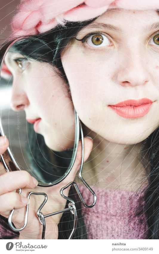 Close up of a beautiful woman reflected in a mirror beauty cosmetics lipstick close up young fashion trendy cool reflection brunette sensual face pretty youth