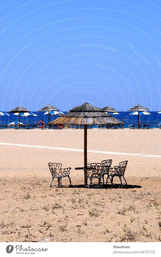 Sand beach chairs straw umbrellas Blue and beige Vacation & Travel Summer Tourism Ocean Relaxation Deserted Place in the sun Beach Beautiful weather