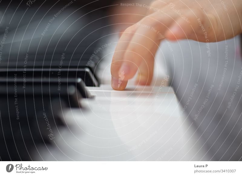 Close up of child finders playing the piano depth unique lessons practice electronic electronic piano close up artist perspective concept fingers skill player