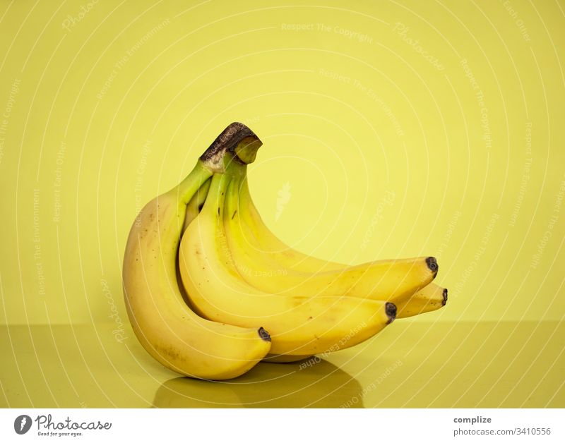 yellow bananas in front of a yellow background Banana Yellow Healthy Eating Fruit- or Vegetable stall fruit fruits tropical fruit Fresh Markets vitamins