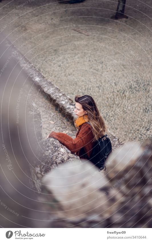 Young woman visiting Moorish Castle in Sintra, Portugal landscape tour tourism castelo architecture moorish horizontal history historical building lisboa mouros