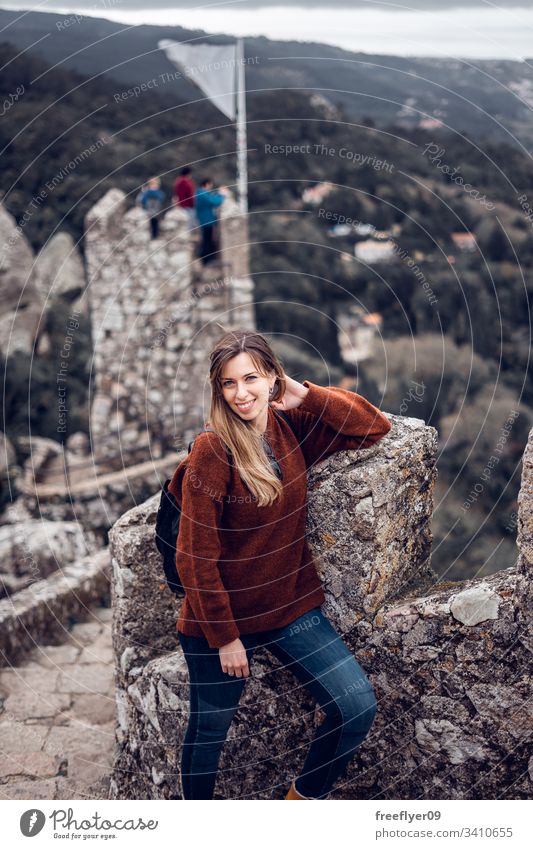 Young woman enjoying Moorish Castle in Sintra, Portugal landscape tour tourism castelo architecture moorish horizontal history historical building lisboa mouros