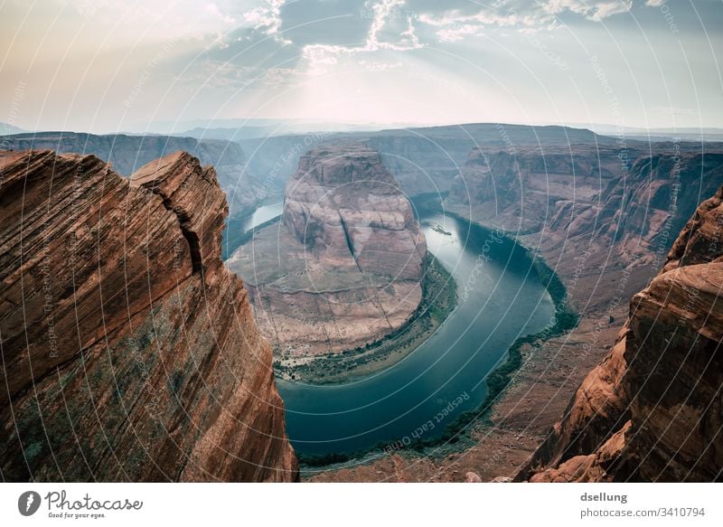 Horseshoe Bend with sunrays in the sky Mountain stream Mountain torrent Flow Nature Reflection Untouched river Colorado River Page Americas National Park USA