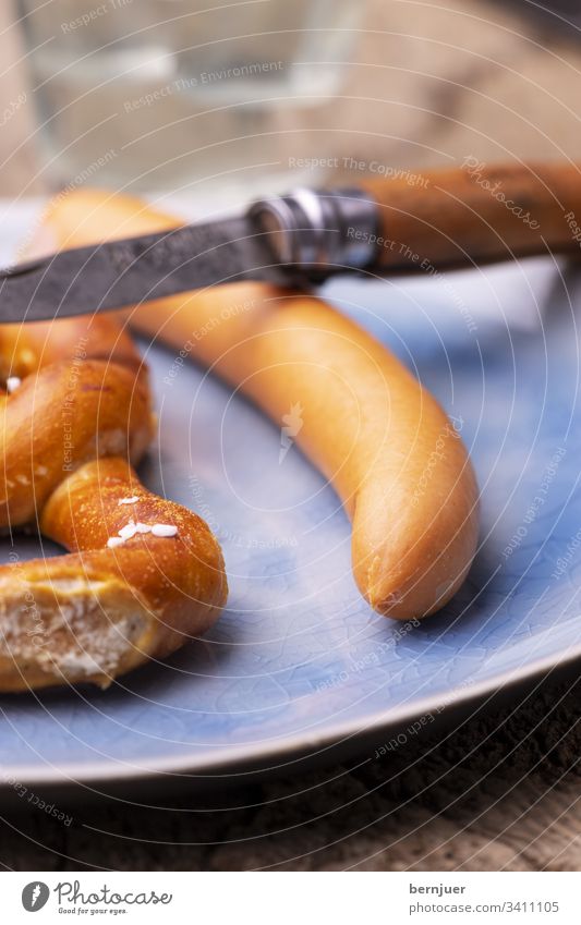 Pretzel with Frankfurter sausage on the plate Vienna Eating Bratwurst Snack Hot dog Breakfast Oktoberfest Wienerwurst Mustard Meat Rustic Germany Kitchen veal