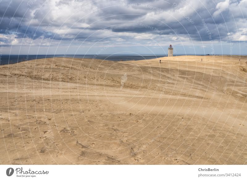 Lighthouse in the dunes Sand Blown away Strang North Sea Clouds Sky Exterior shot Colour photo Coast Landscape Nature Vacation & Travel Tourism destination