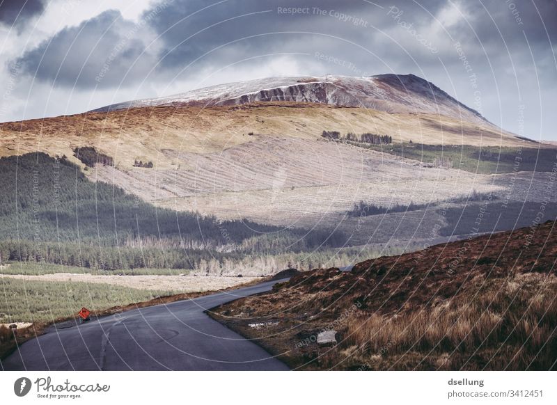 Simple road in Ireland with mountain in the background Panorama (View) Deep depth of field Day Copy Space bottom Deserted Exterior shot Colour photo