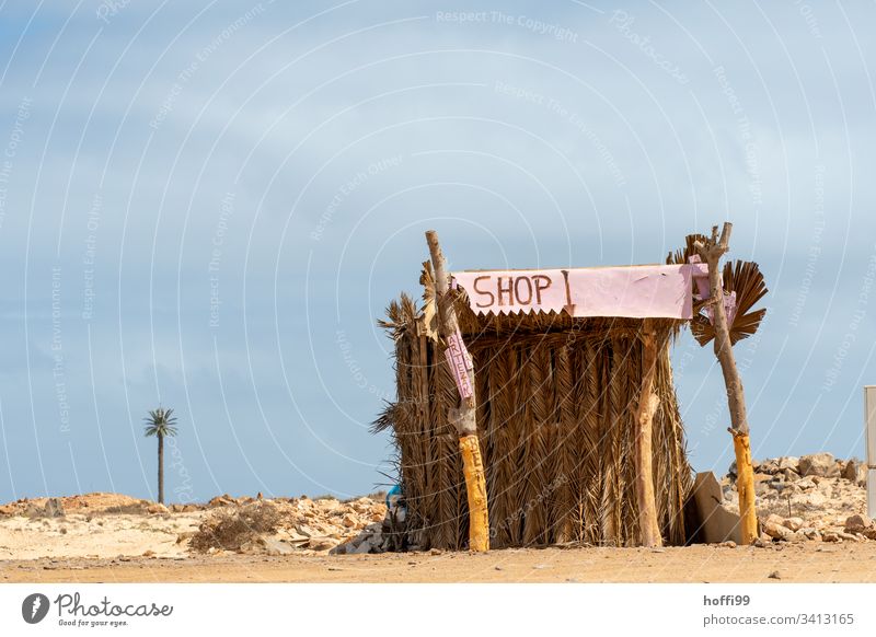 Desert Shop desert landscape Oasis Hill Sand Sun Drought Haze Nature Horizon Warmth Kiosk sales booth Sell stand beach stall Closed Far-off places Deserted Sky