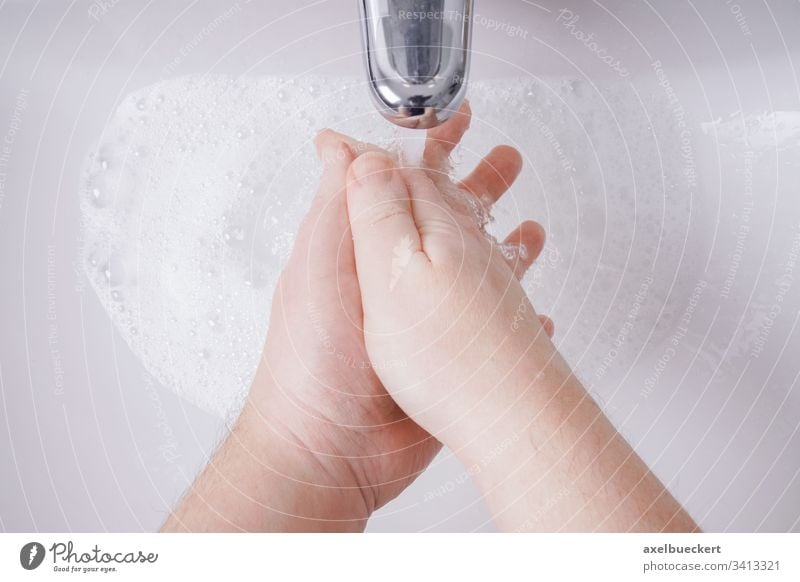 washing hands with soap and water from personal perspective hygiene sink basin bathroom health care clean sanitary healthcare closeup close-up unrecognizable