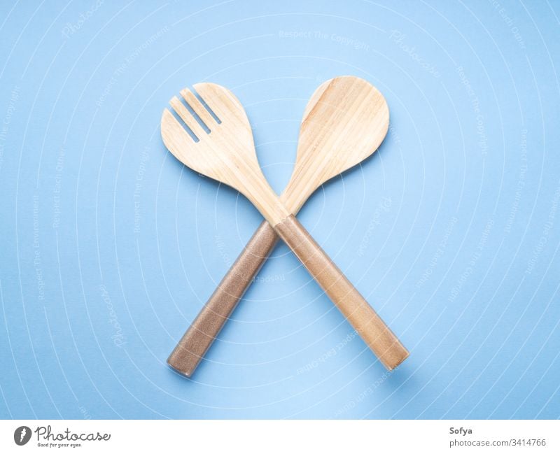 Minimal cooking, eating concept on blue fork spoon background food cutlery wood pastel color turquoise minimal abstract ban forbid meal lunch dinner light diet