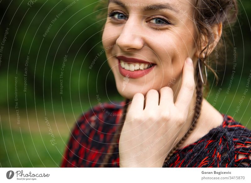 Portrait of young woman adult attractive beautiful beauty casual cute face fashion female hair happiness happy joy lady lifestyle model nature outdoor park