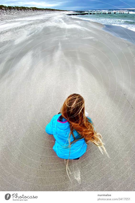 beach child Child Girl Beach Gale Baltic Sea Sand hair Blow Break water best Spring Crouch Observe Playing Freeze Waves Clouds Blue stormy Natural neat Pure