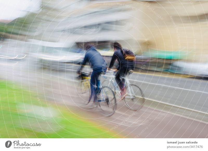 people ciclyng on the street in Bilbao city Spain, healthy life cyclist biker bicycle transportation cycling biking exercise ride speed fast blur blurred motion