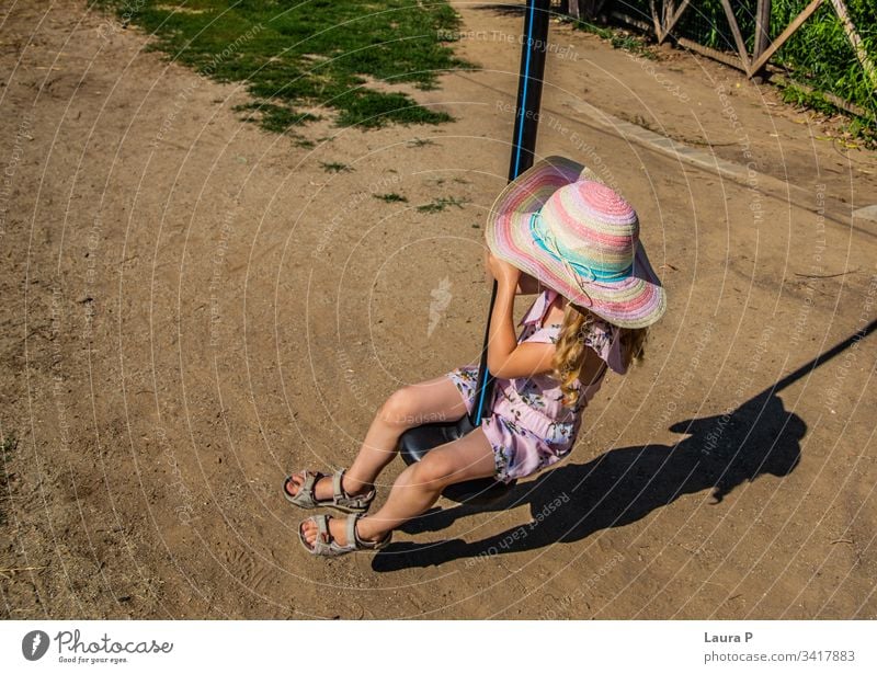 Little girl riding a zip line in the park activity adventure amusement amusement park brave child child playing childhood courage cute enjoy entertainment