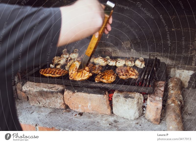 Close up of a man preparing a barbecue background barbecued barbecuing barbeque bbq beef black burn camping charcoal coals cook cooking dark dinner fire