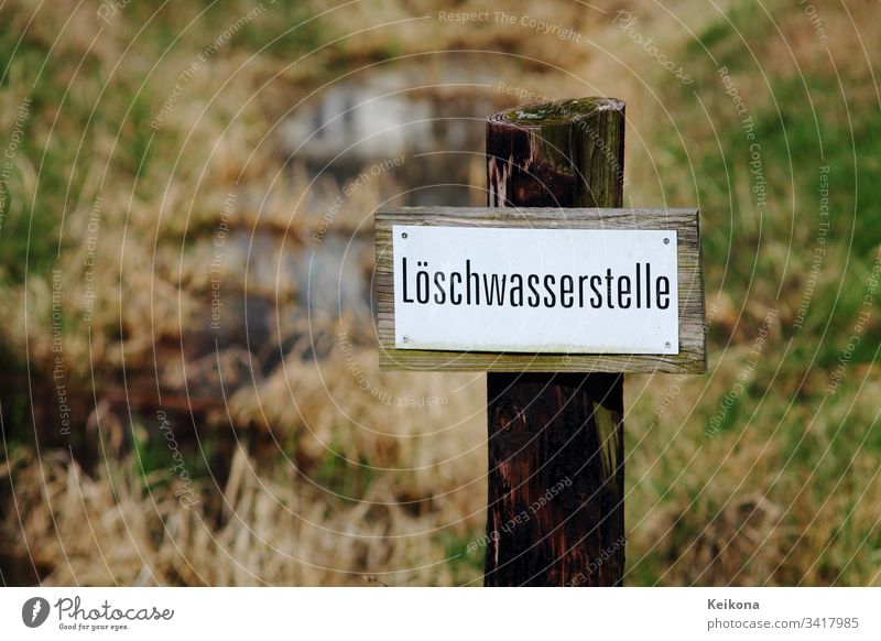 Fire water point in the field. Water channel in the field to be used for fire. Erase Fire department Field acre Germany Channel reservation grass aridity blaze