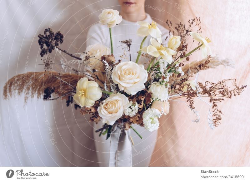 Young woman in a white dress holding a bouquet of flowers. Vintage, romantic concept. girl soft light beautiful vintage wedding young beauty happy pink cute