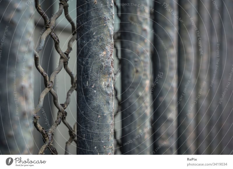 Bars at the window of an old warehouse. slats Aspire Fence Waves Garden fence wavy lines Architecture Modern Abstract Facade Economy real estate technique