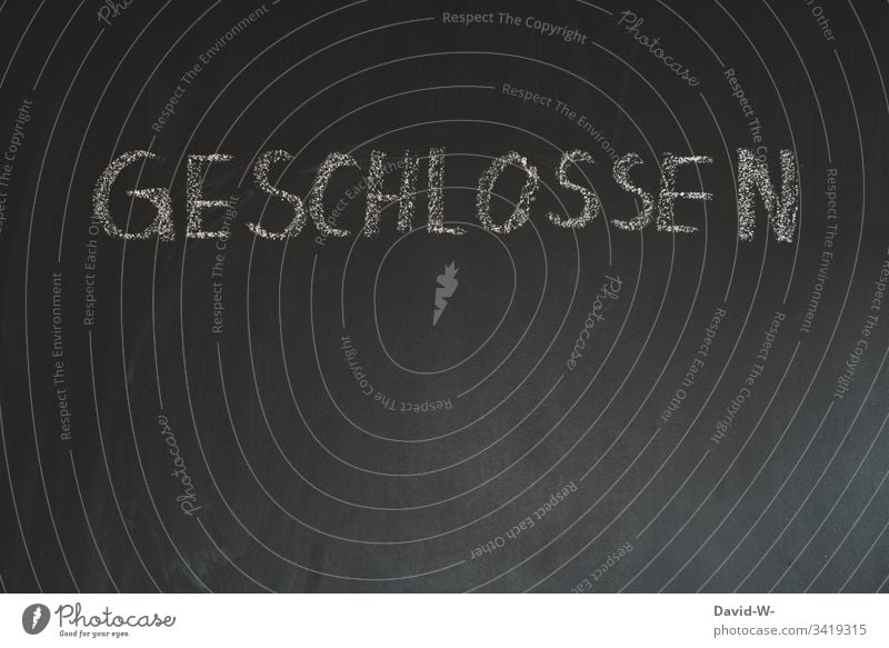 Closed writing word chalk on blackboard Word lettering coronavirus Chalk Blackboard interdiction too chalk writing Copy Space bottom