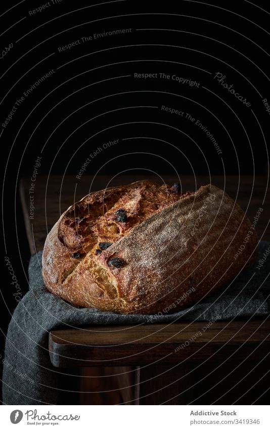 Fresh artisan bread on table loaf food fresh homemade delicious rustic bakery crust tasty meal nutrition natural healthy cuisine baked grain raisin sourdough