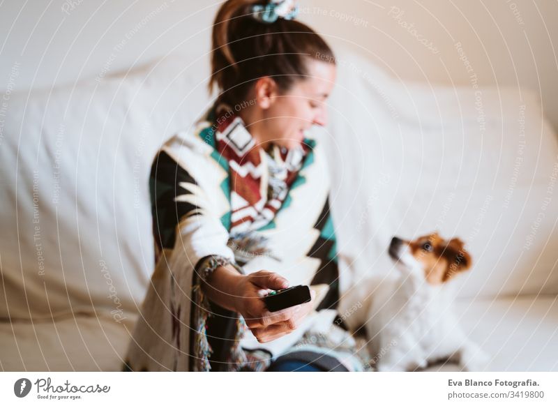 close up view of unrecognizable woman holding remote tv control at home. Television and technology concept television young indoors daytime modern alone quest