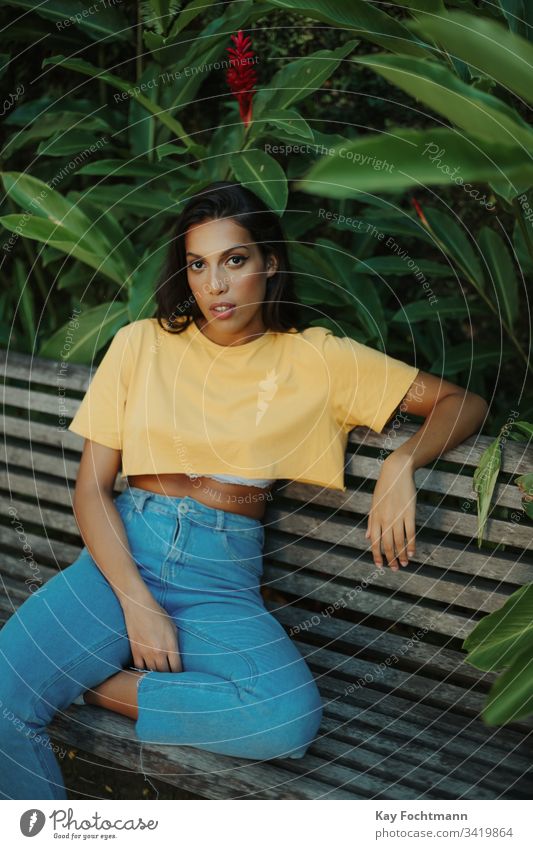 woman sitting on bench in park Twenties youthful Rio de Janeiro portrait person Outdoors outside Park people relaxed Model Looking Lifestyle hispanic