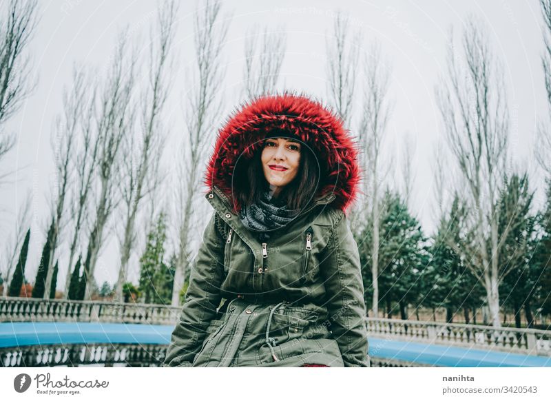 Young cool woman with ghotic style in an urban place city winter clothes goth rock modern casual wear trendy coolness fresh freshness youth outdoors park