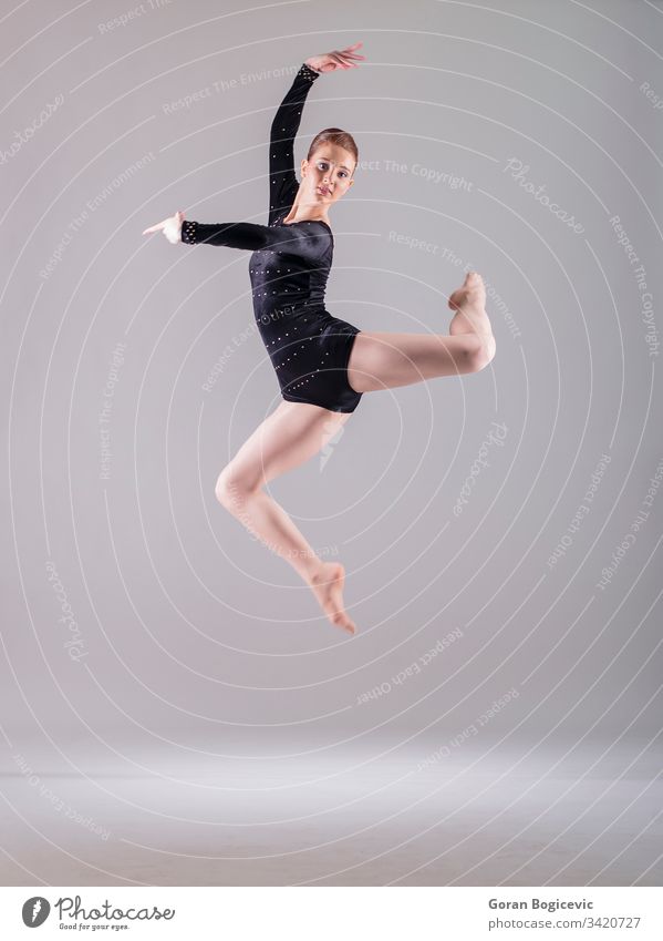 Ballerina beauty black modern balance girl female woman jump person fly caucasian body human cute foot one active young leg adult action studio elegance