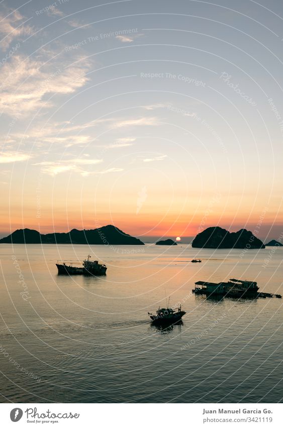 Sunset from the island Beauty ba background beach beautiful boat cat coast color fishing halong idyllic landscape light nature orange reflection scene sea sky