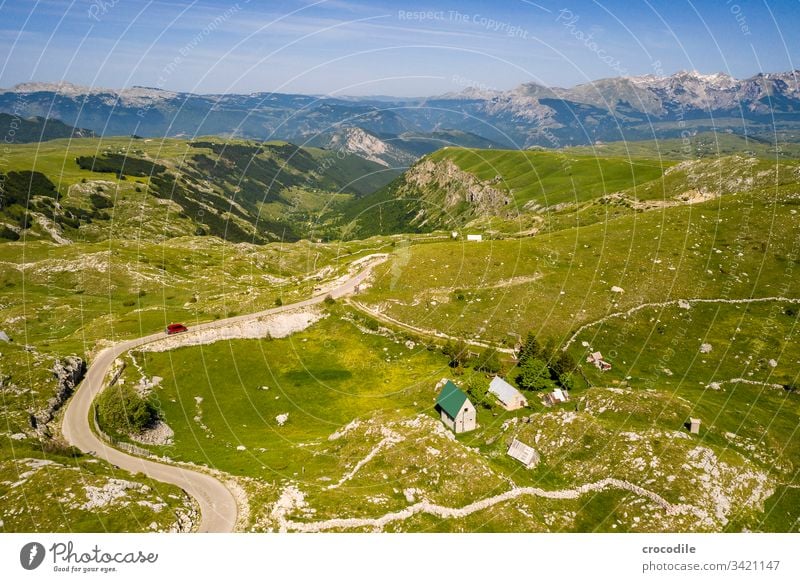 Durmitor Nationlapark Roadtrip Street road trip houses bulli VW T6 vw bus Montenegro durmitor Meadow Mountain UAV view Aerial photograph hilly