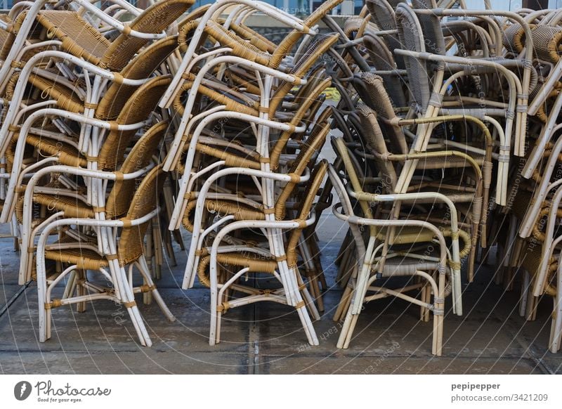 Chairs stacked chairs Seating Empty Vacation & Travel Furniture Deserted Exterior shot Places Wait Wood pack up Loneliness Gloomy Calm