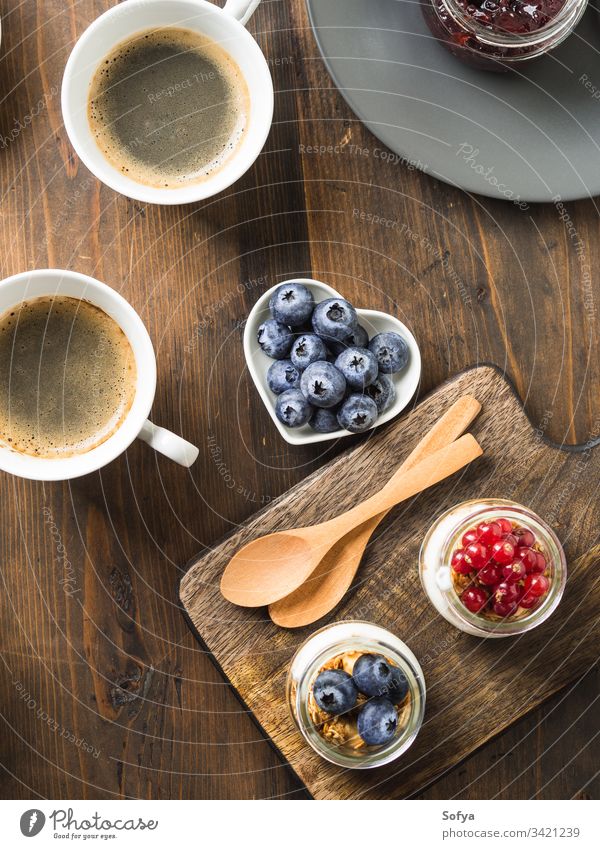 Cozy Breakfast food concept dark wooden background breakfast table rustic cozy coffee drink hot set serve frame berries yogurt dairy milk item group eat granola