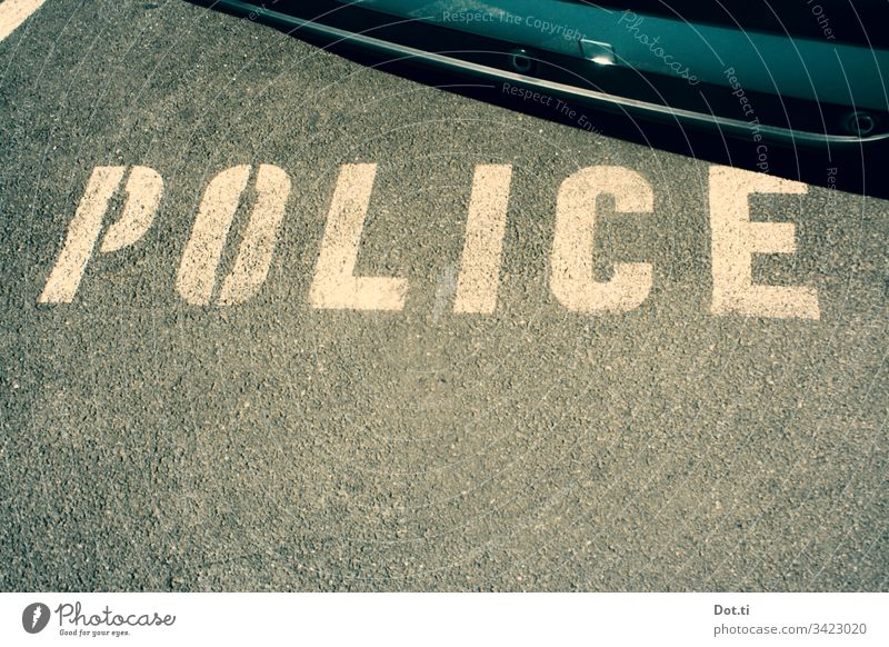 Police parking lot Police Force Asphalt Characters Parking lot car Ground Street Lettering Reserved policy police car street Signs and labeling Deserted