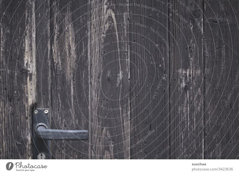 old wooden door with door handle Wood Old dilapidated Exterior shot Deserted Door Goal locked Closed Entrance Front door Door handle Detail Lock