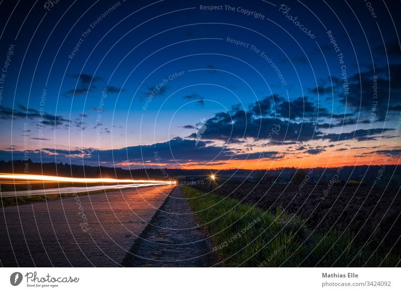 skid marks from a car on a country road Long exposure Light (Natural Phenomenon) Exterior shot Copy Space top Multicoloured Night Dark Colour photo Night life